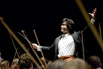 Man (Daryll Ang) orchestrating symphony